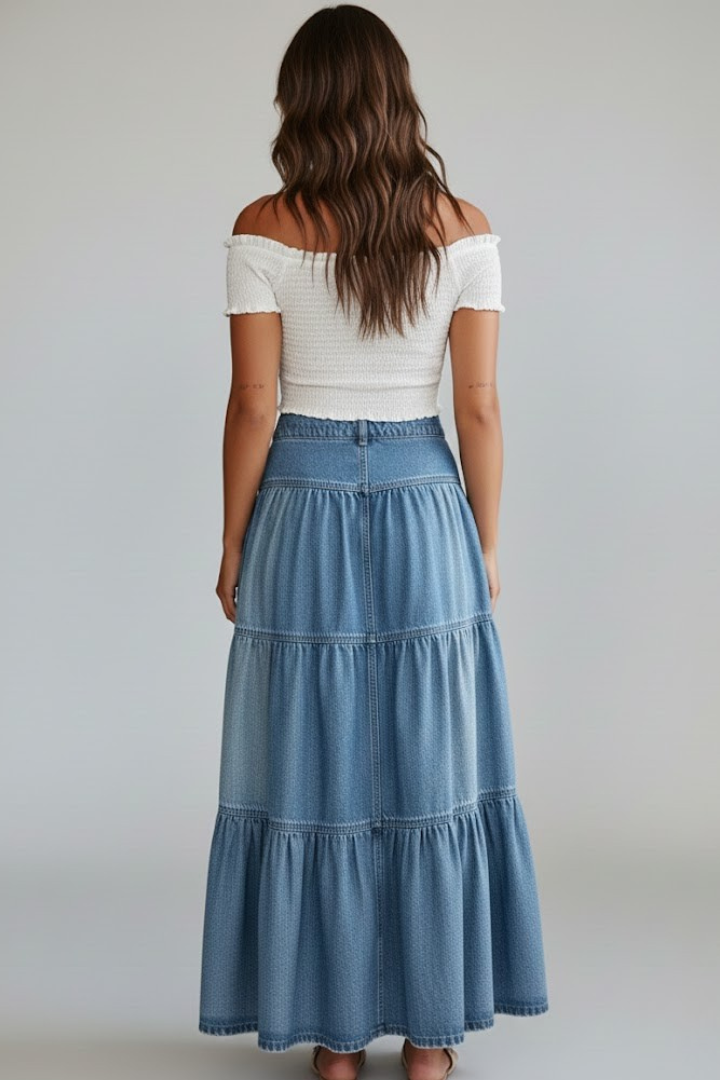 Back view in tiered denim skirt gray background