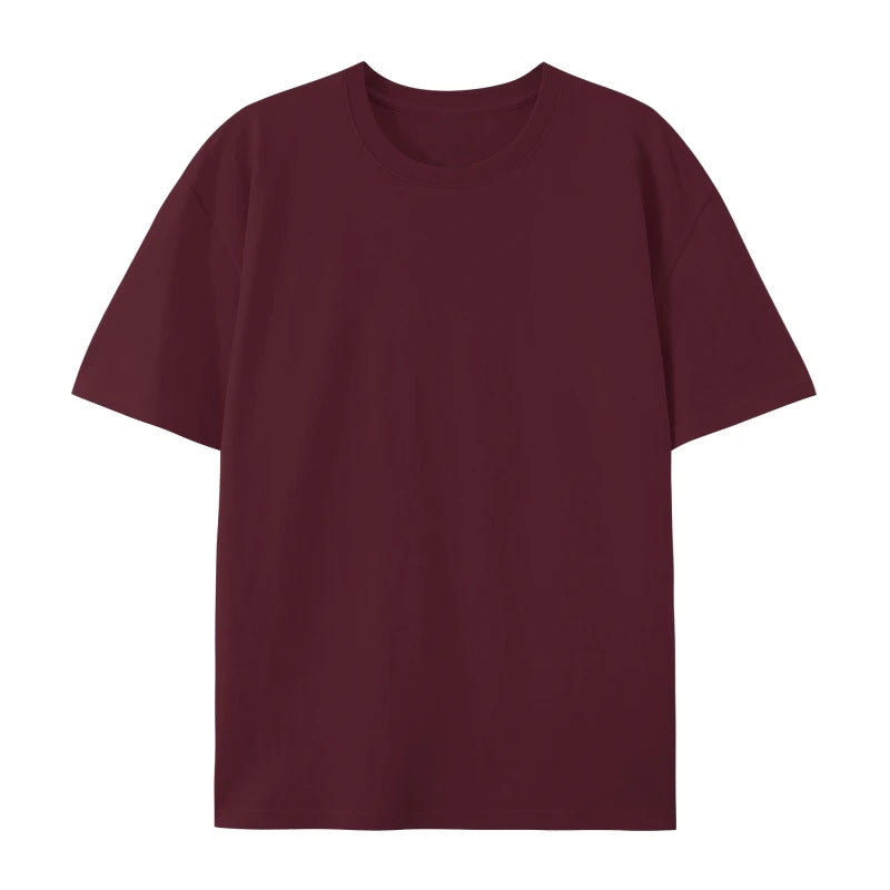 Woman showcasing a loose cotton T-shirt with a casual and modern appearance.
