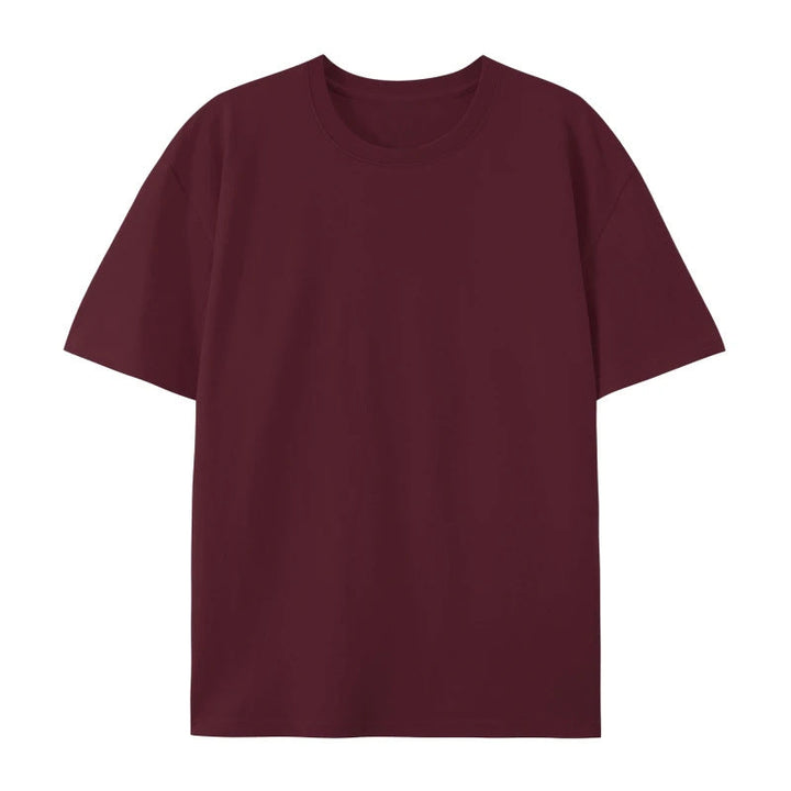 Woman showcasing a loose cotton T-shirt with a casual and modern appearance.
