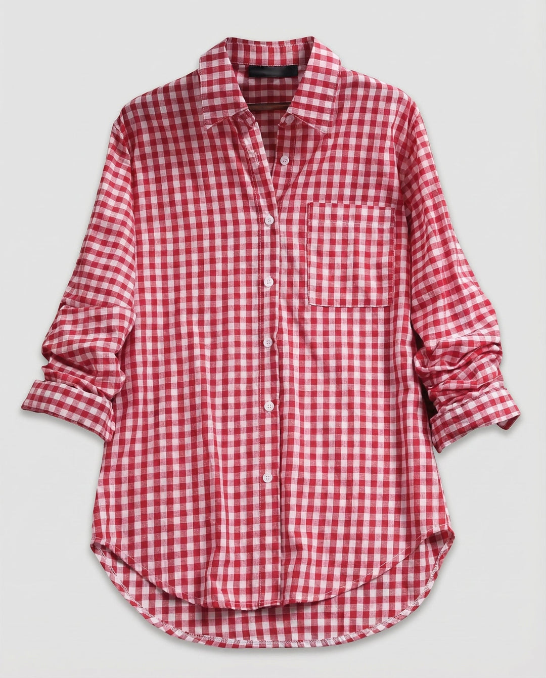 Female model in a checked shirt blouse with button details and a relaxed shape.