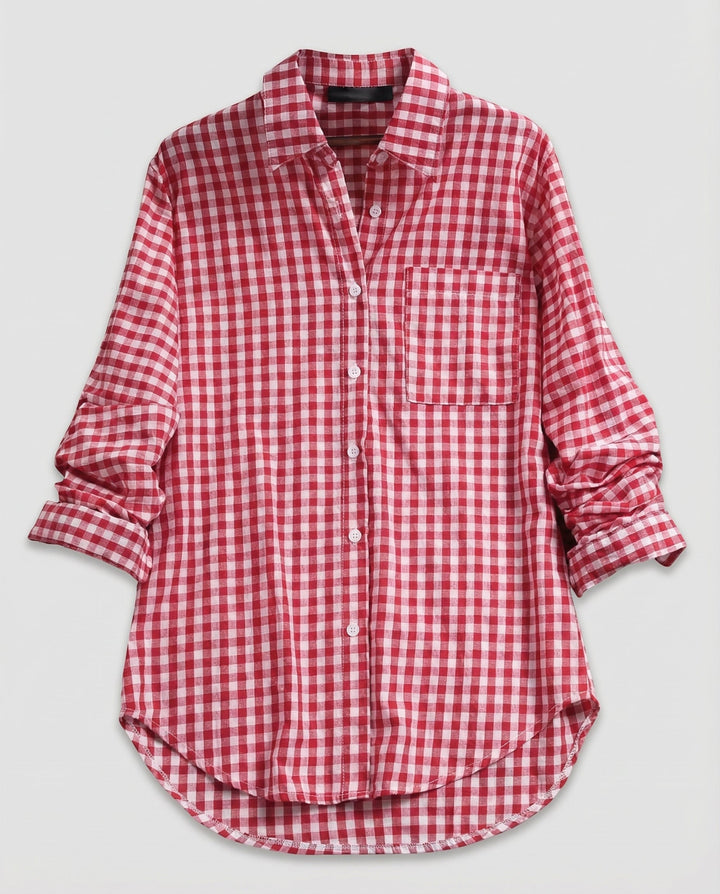 Female model in a checked shirt blouse with button details and a relaxed shape.