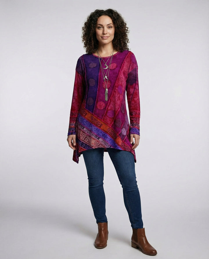 Female model showcasing a colourful vintage-inspired tunic with a round neckline.
