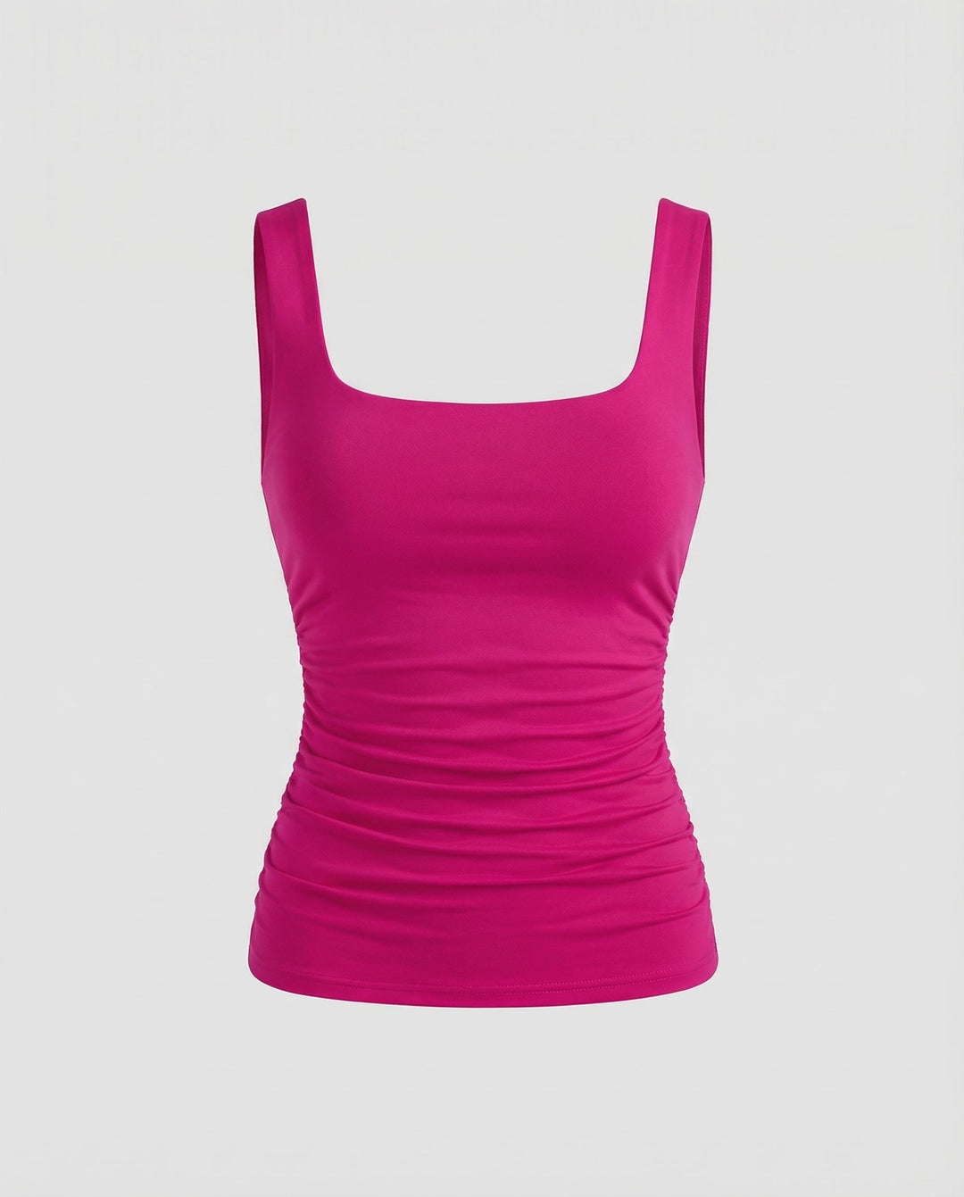 Female model showcasing a versatile square neck top on a plain background.
