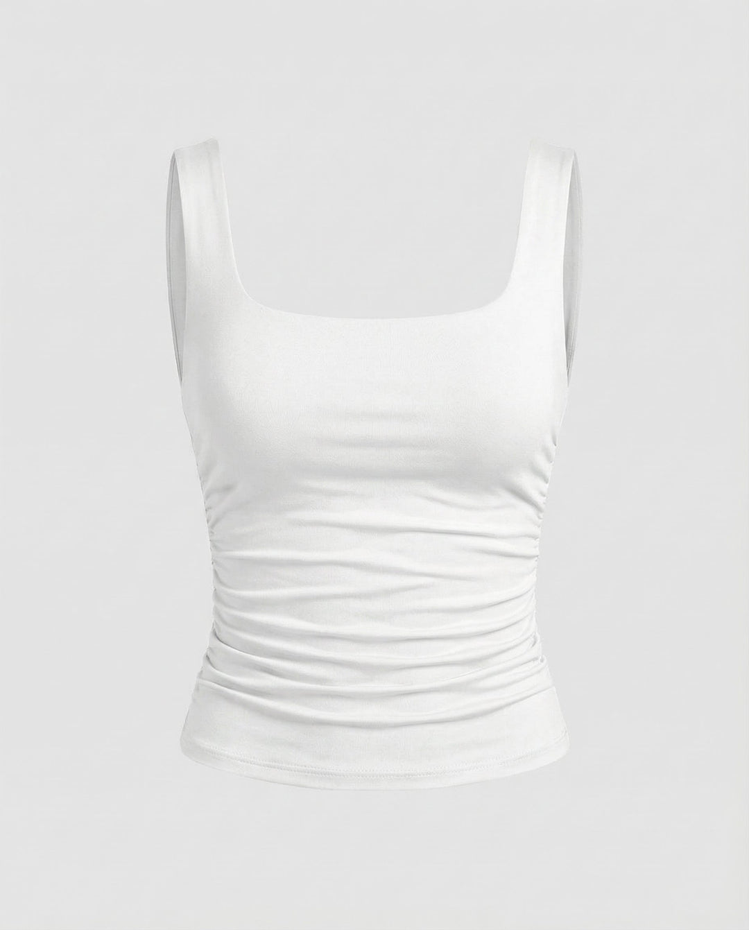 Woman in a fitted stretch top with broad straps and a sleek shape.