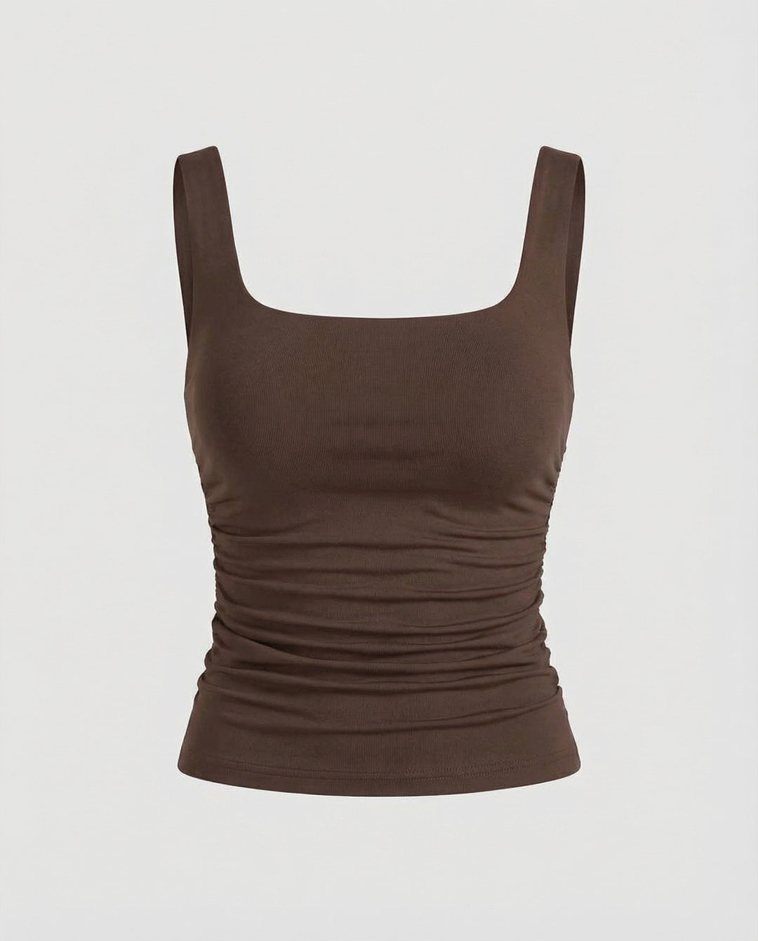 Woman wearing a sleeveless fitted top with a clean and modern silhouette.