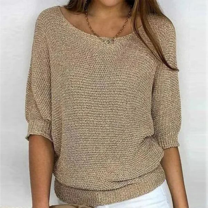 Woman standing relaxed fit sweater front pose plain background