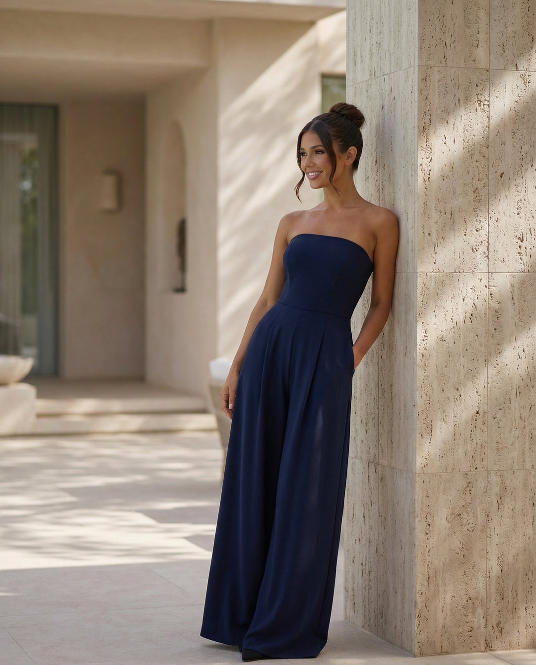 Female model in a strapless straight neckline jumpsuit   