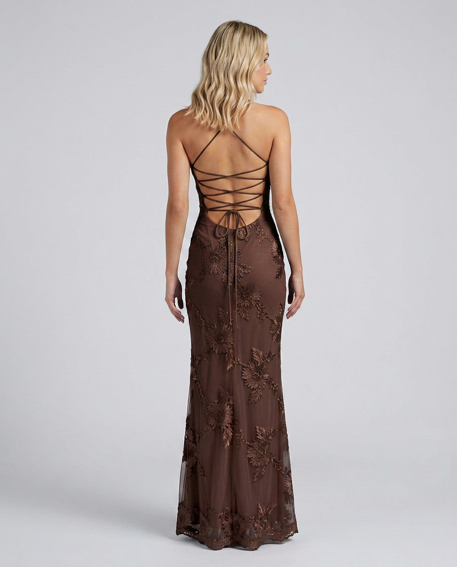 Woman in a floral embellished maxi dress with slim straps a