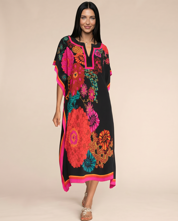 Loose resort-style multicolour dress with side slits shown on a clean background.