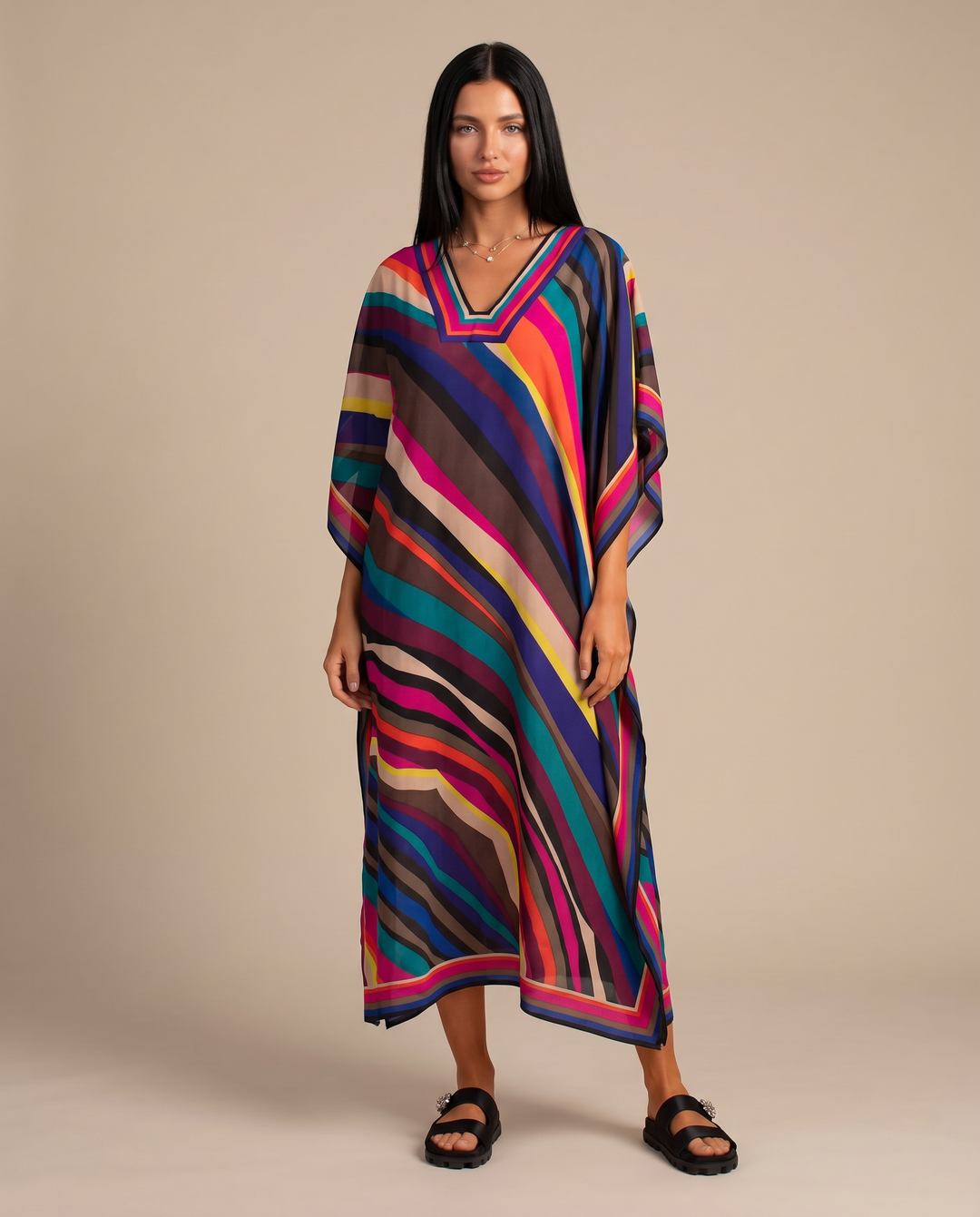 Relaxed flowing summer dress with graphic print shown on a wearer against a plain background.