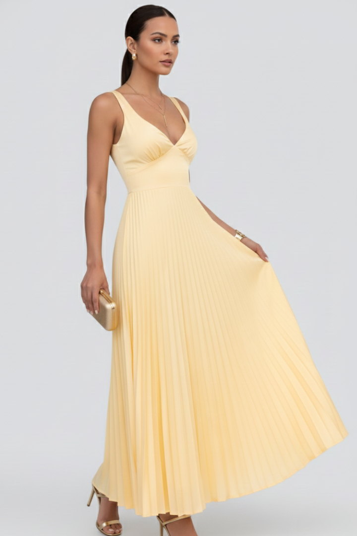 Female woman on side angle flowing pleated gown gray background