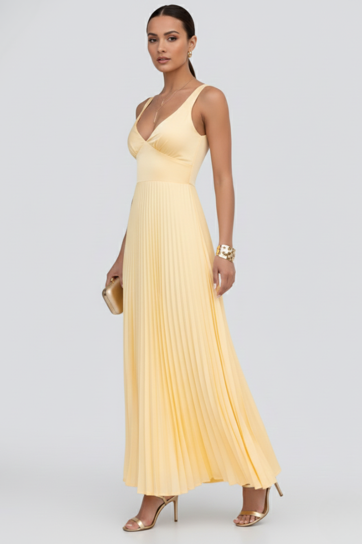 Woman in adjustable strap yellow dress side angle detail gray background photo