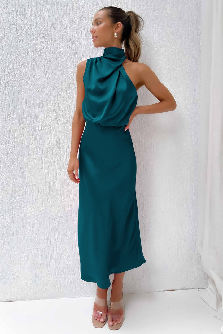 Female model in a satin dress designed for gala and formal events.