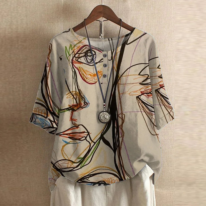 Front display of loose floral women’s top
