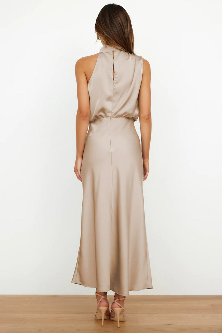 Satin formal dress with a draped silhouette worn by a female model.
