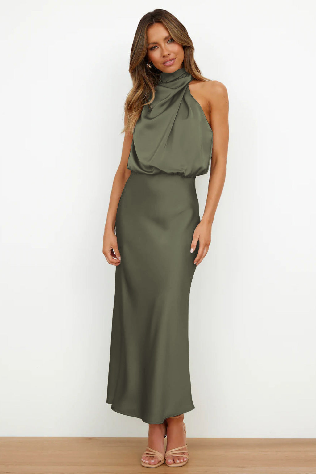 Satin eveningwear featuring a flowing design and high neckline.