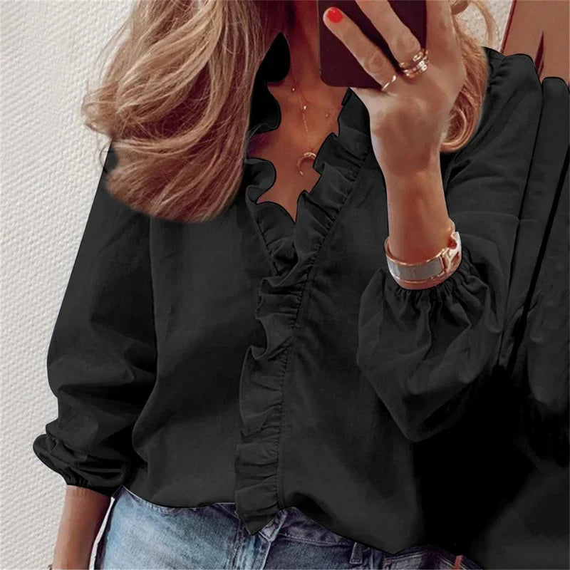 Wrap front blouse with soft ruffle trim shown on a model.