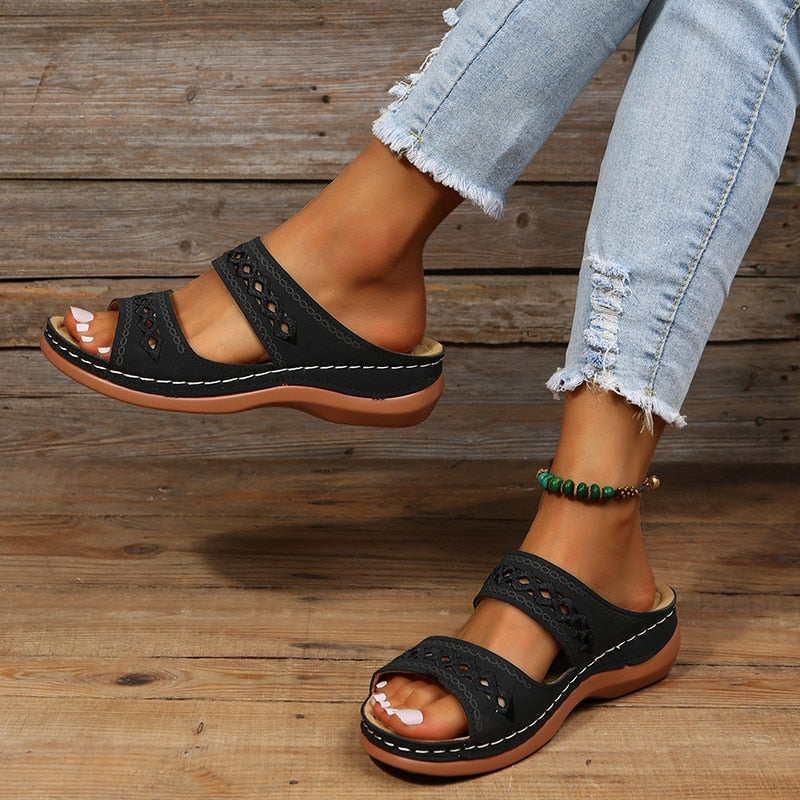 Natural standing pose sandals worn on gray wooden background