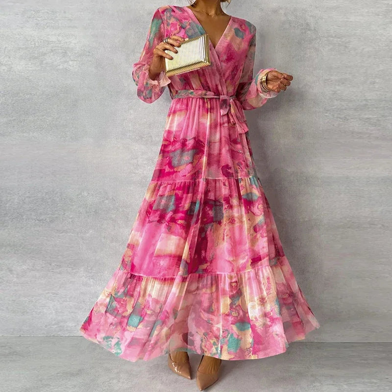 Floral pattern dress close front hanging plain background detailed view