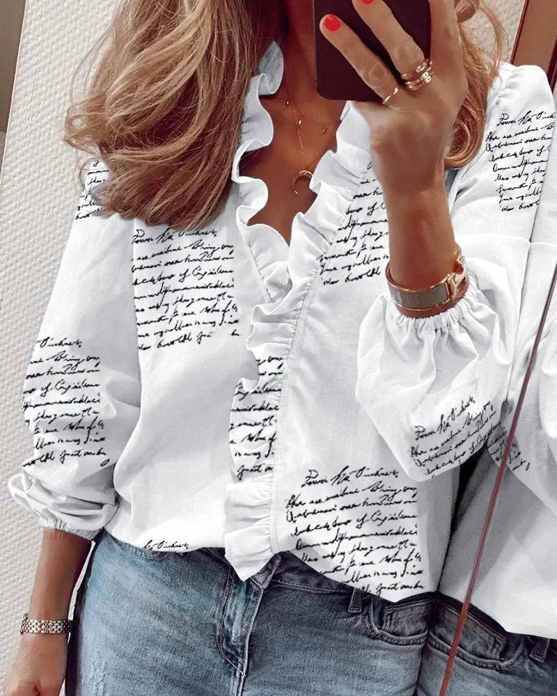 Warm-weather wrap blouse with neckline ruffle detail on a model.