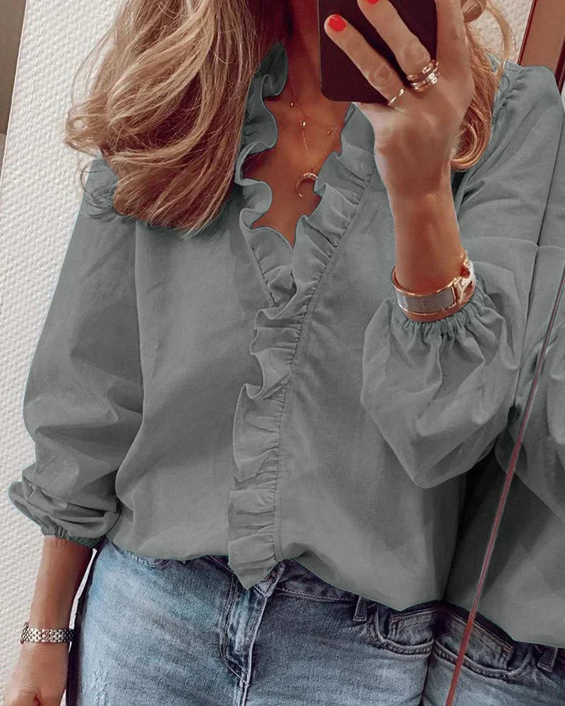 Casual daily wear blouse with wrap silhouette shown on a model.