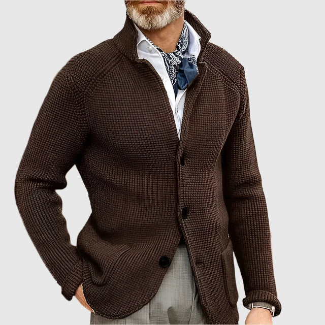  Male model presenting a refined two-piece suit for seasonal styling on a plain background.