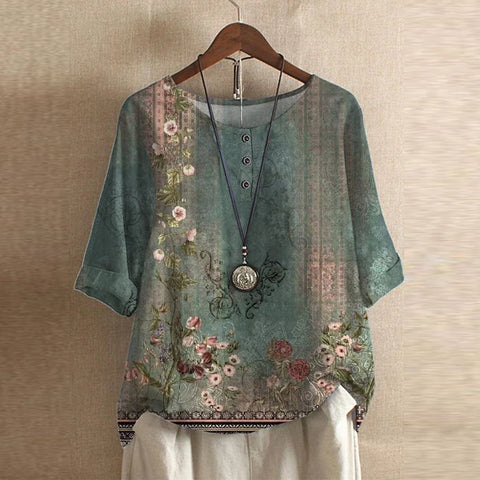Green floral blouse front view on hanger