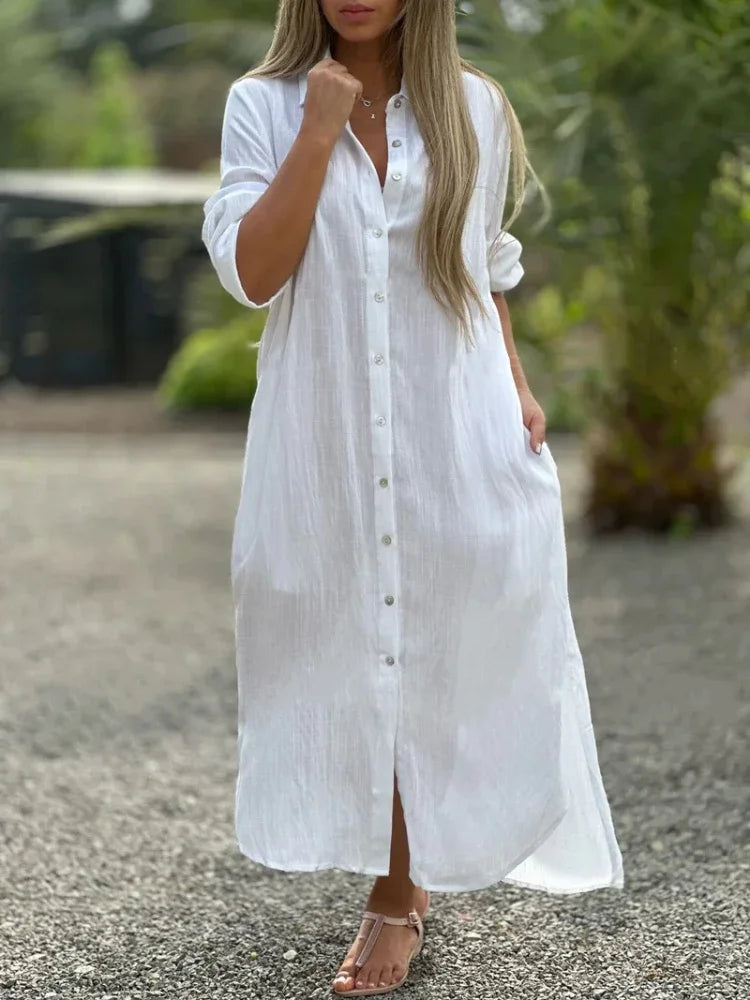 Female model styled in a relaxed fit maxi shirt dress against a plain backdrop