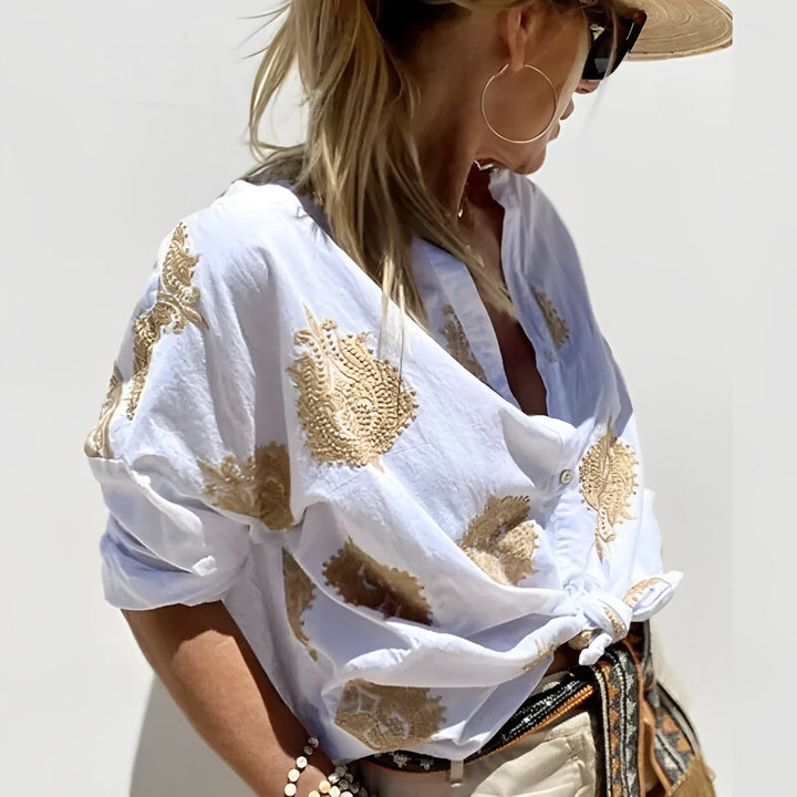 Woman wearing casual summer blouse front angle