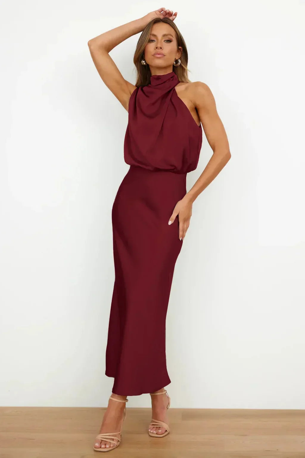 Long satin formal dress with soft shine worn by a woman.