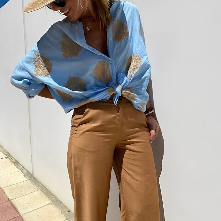 Female model side angle wearing flowy boho top 