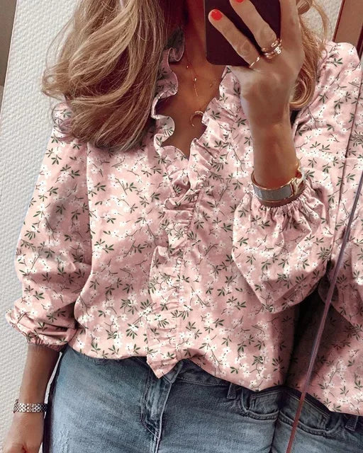 Relaxed fit ruffle blouse displayed on a model for daily wear.