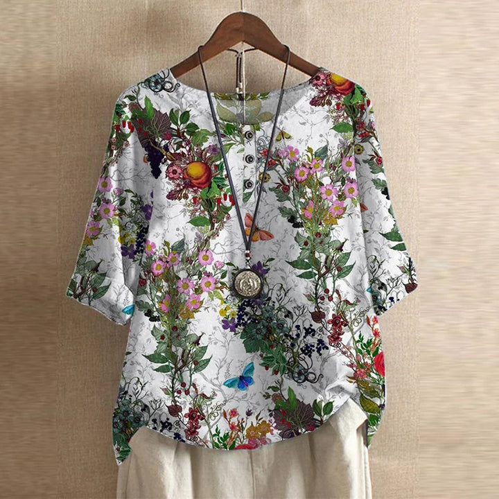 Vintage style floral blouse on beige background