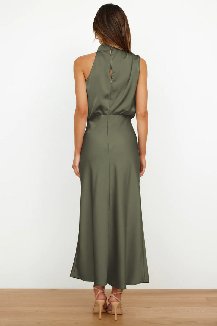 Sleeveless satin maxi dress styled for weddings and evening events.