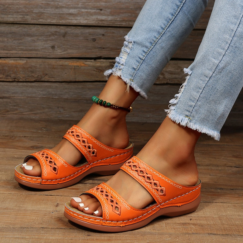 Dynamic angle showing sandals on foot model wooden studio setting