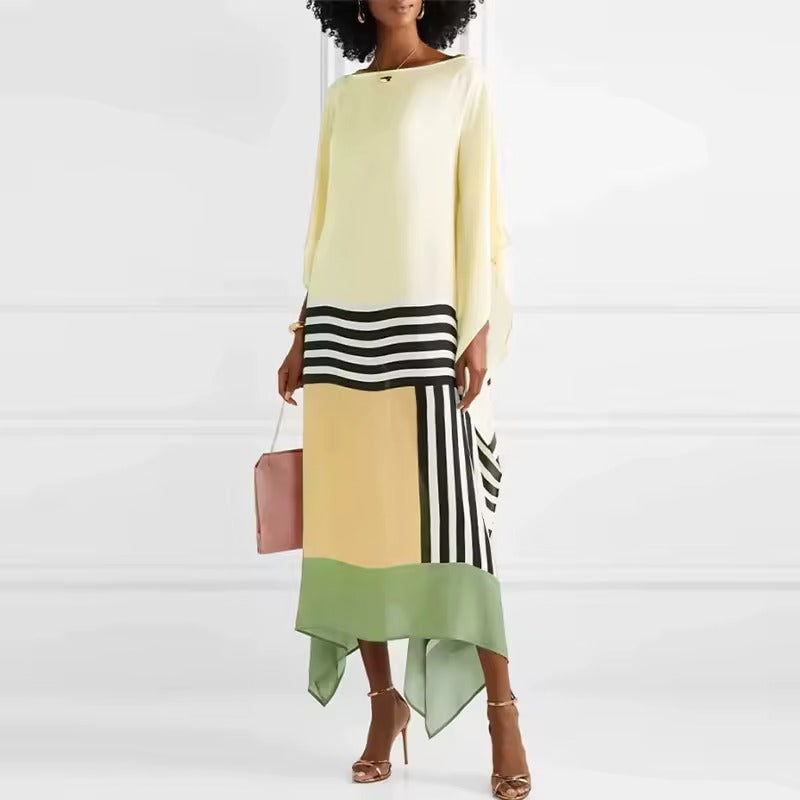 Flowing kaftan dress displayed on a model with a clean background.