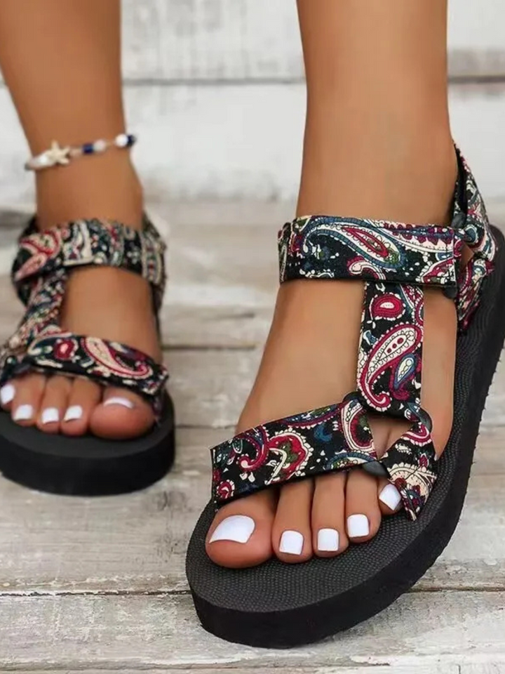 Flat sandal front view plain background showing sole pattern