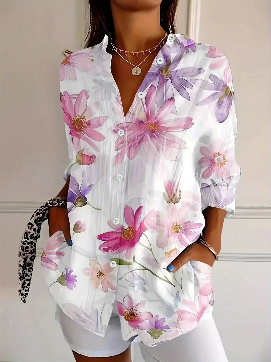 Detail shot of white floral button front top