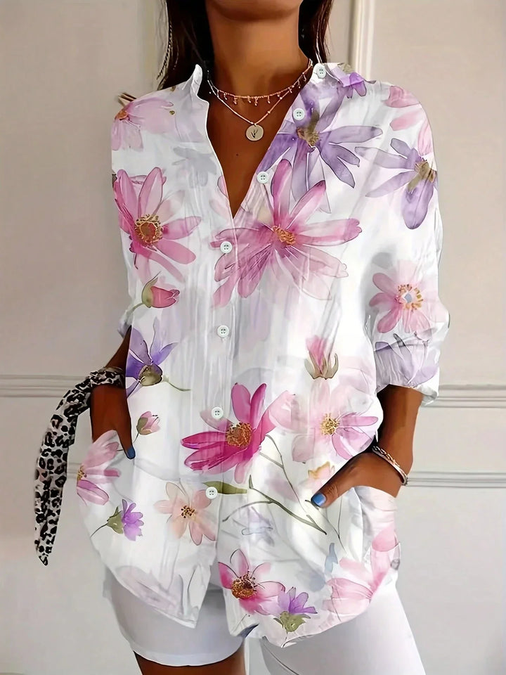 Detail shot of white floral button front top