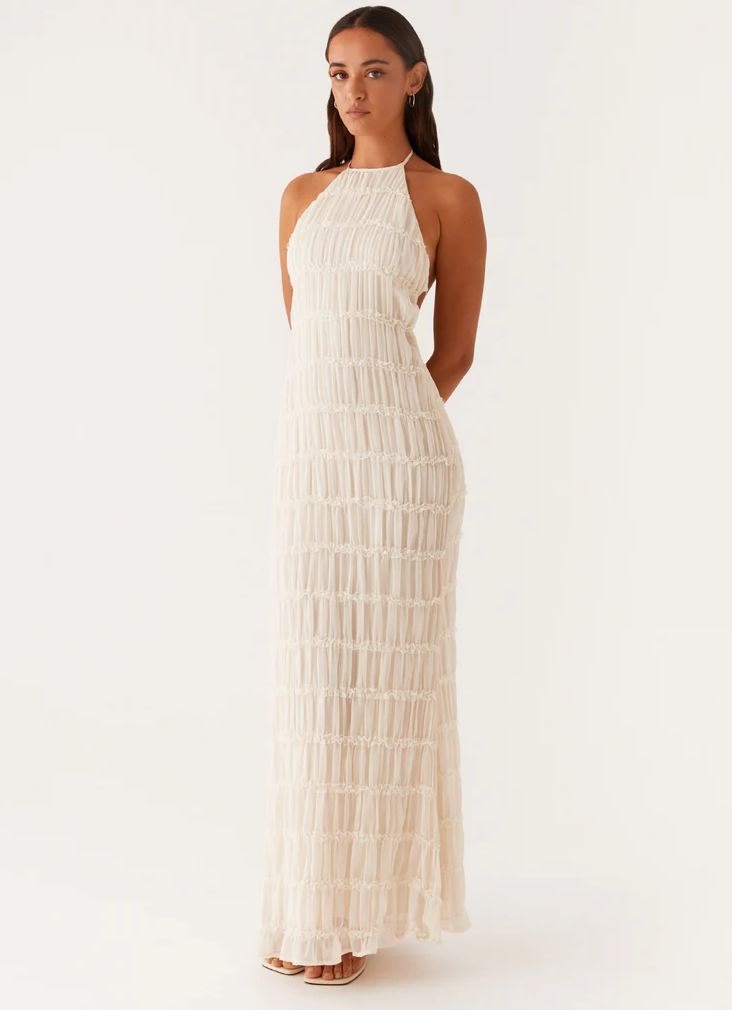 Formal women’s footwear on a plain background with a sleek dress-ready look.