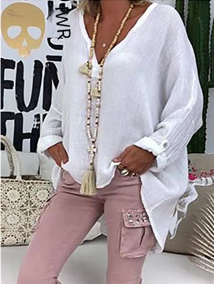 Model front pose highlighting clean neckline blouse plain background neutral
