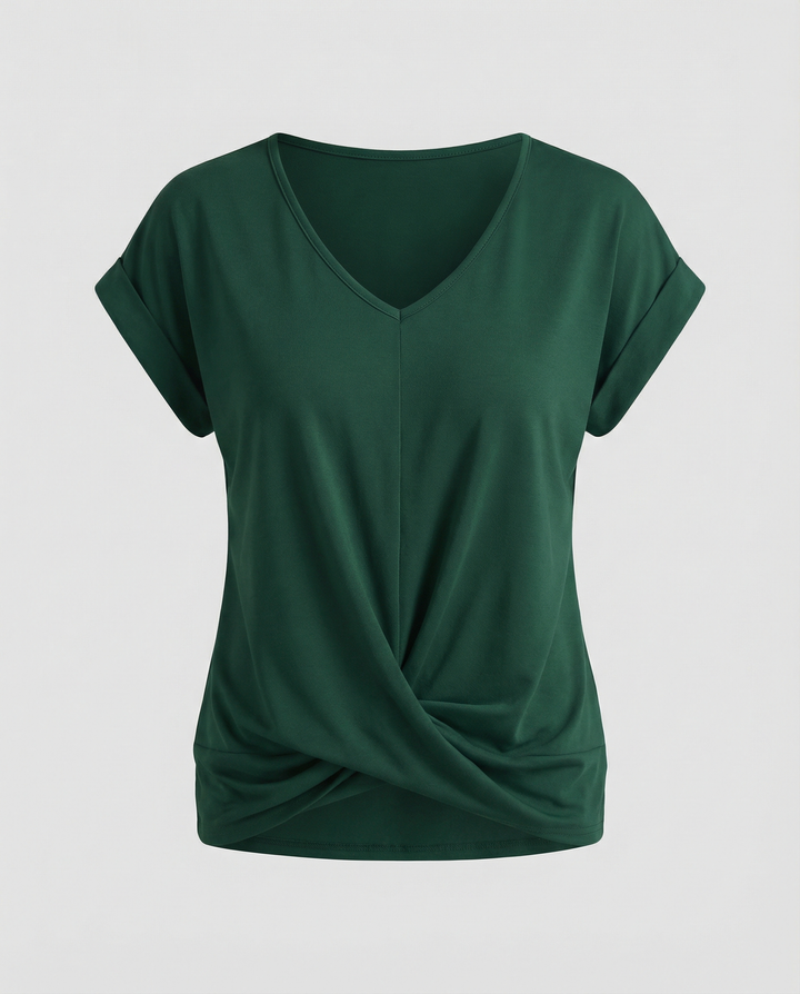 Female model styled in a lightweight blouse with short sleeves and a classic neckline.
