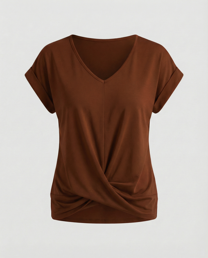 Woman wearing a versatile V-neck blouse suitable for work and casual occasions.
