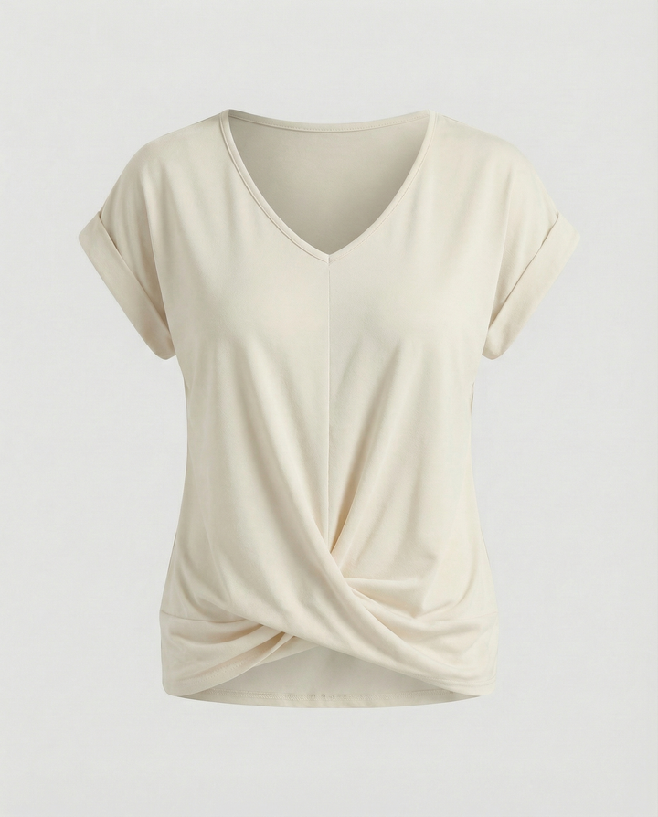 Woman showcasing a stylish short sleeve blouse with a feminine silhouette.

