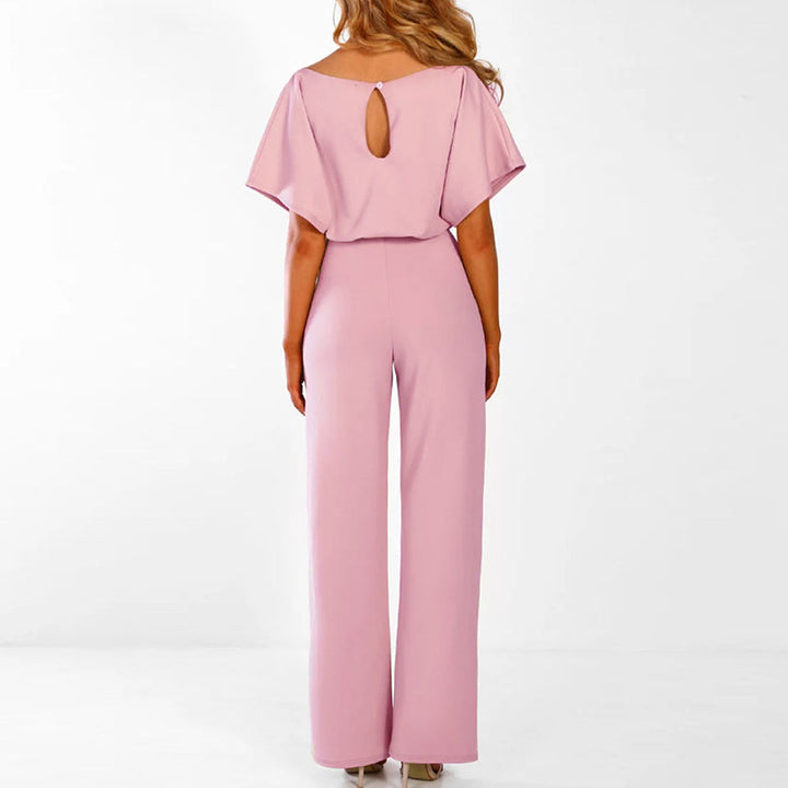 Model standing back view showcasing belted waist and relaxed silhouette plain