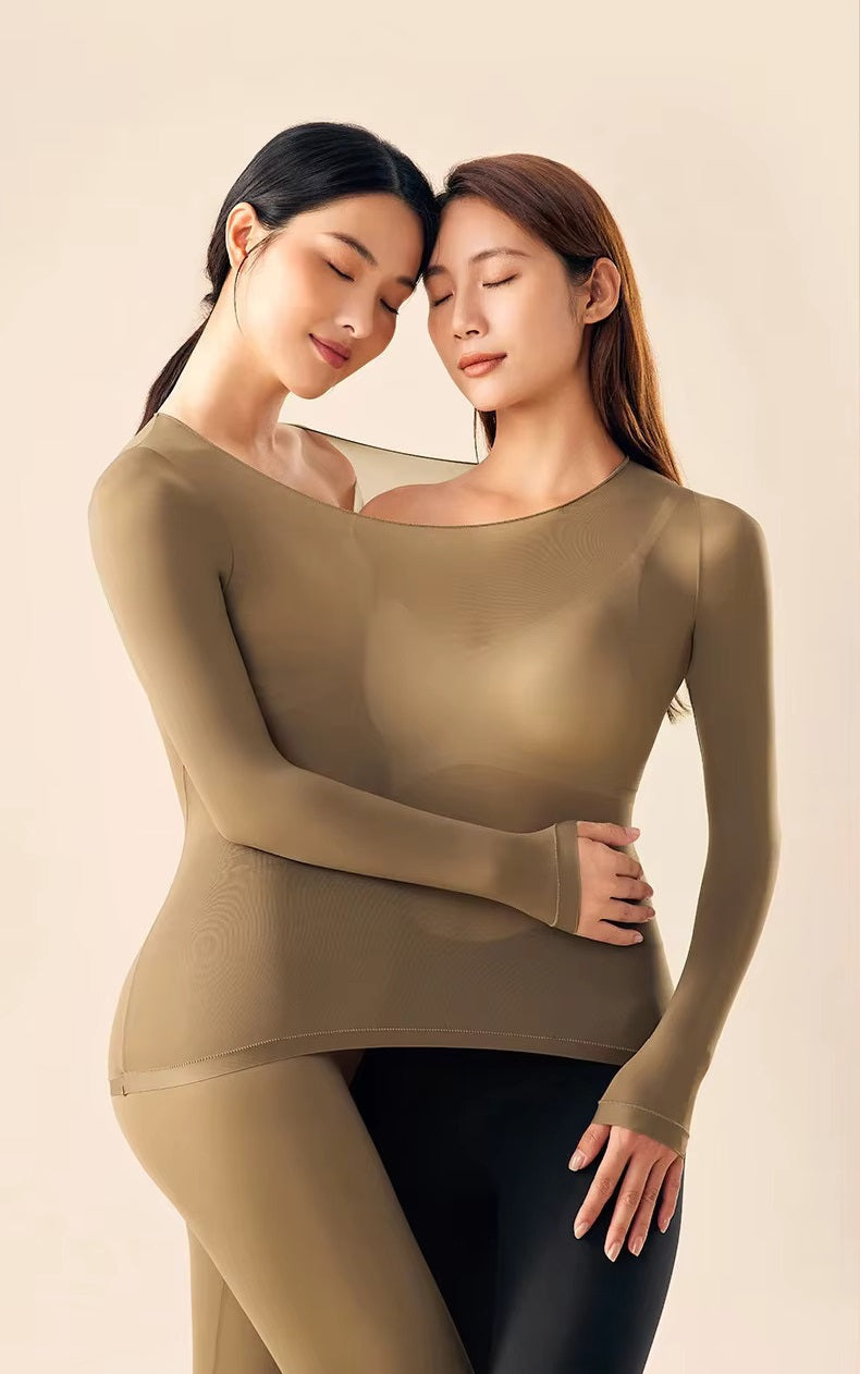 Female model styled in a sleek thermal underwear outfit on a plain background.
