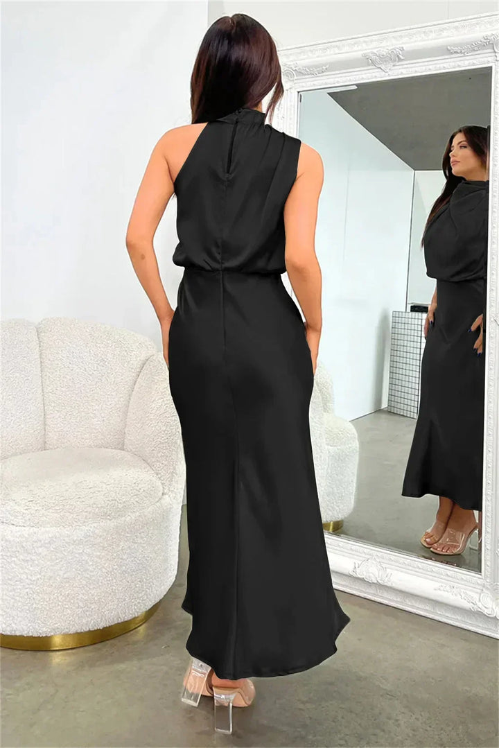 Female in a sleek satin dress featuring a high-neck design.