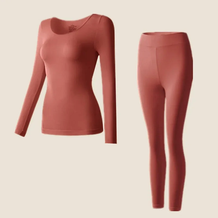Round neck long sleeve top and leggings on a plain background.