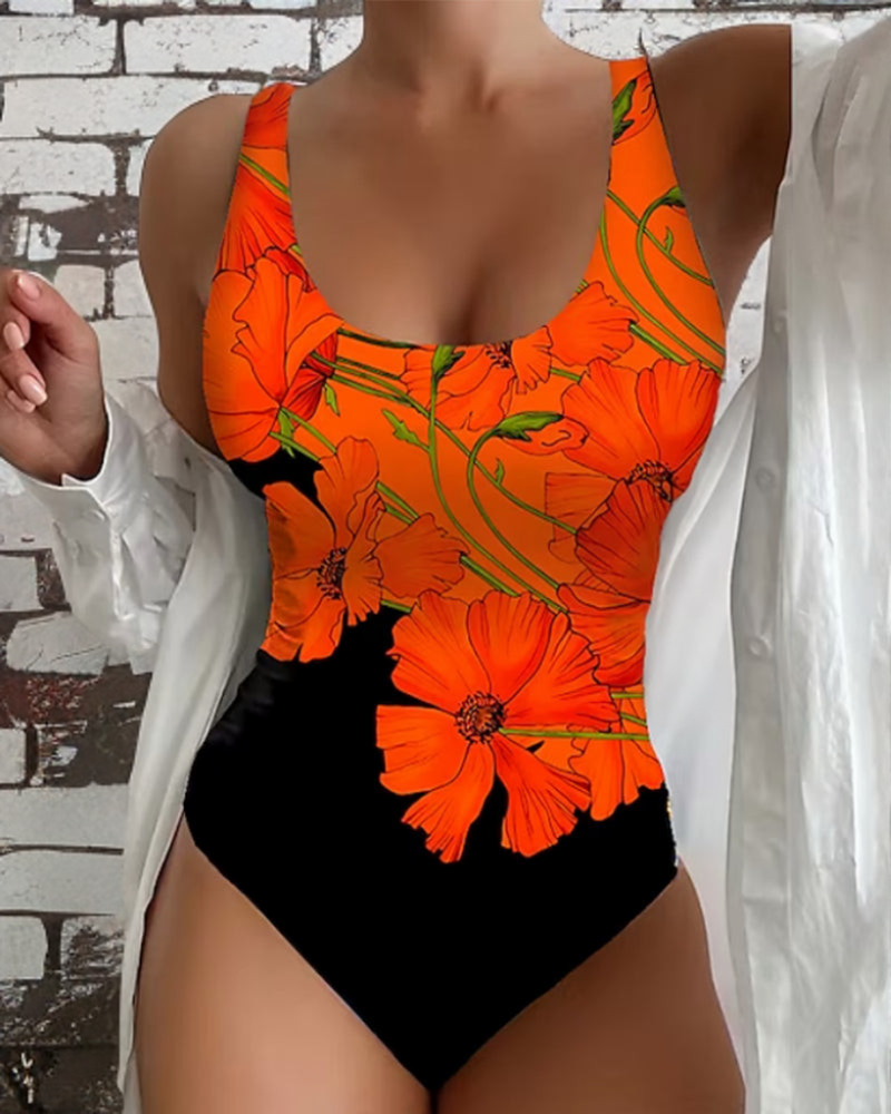Woman wearing a floral swimsuit against a clean beach background for summer vacation style.