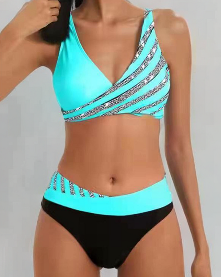Woman wearing a warm-toned bikini on a plain beach background for a sunny resort look.